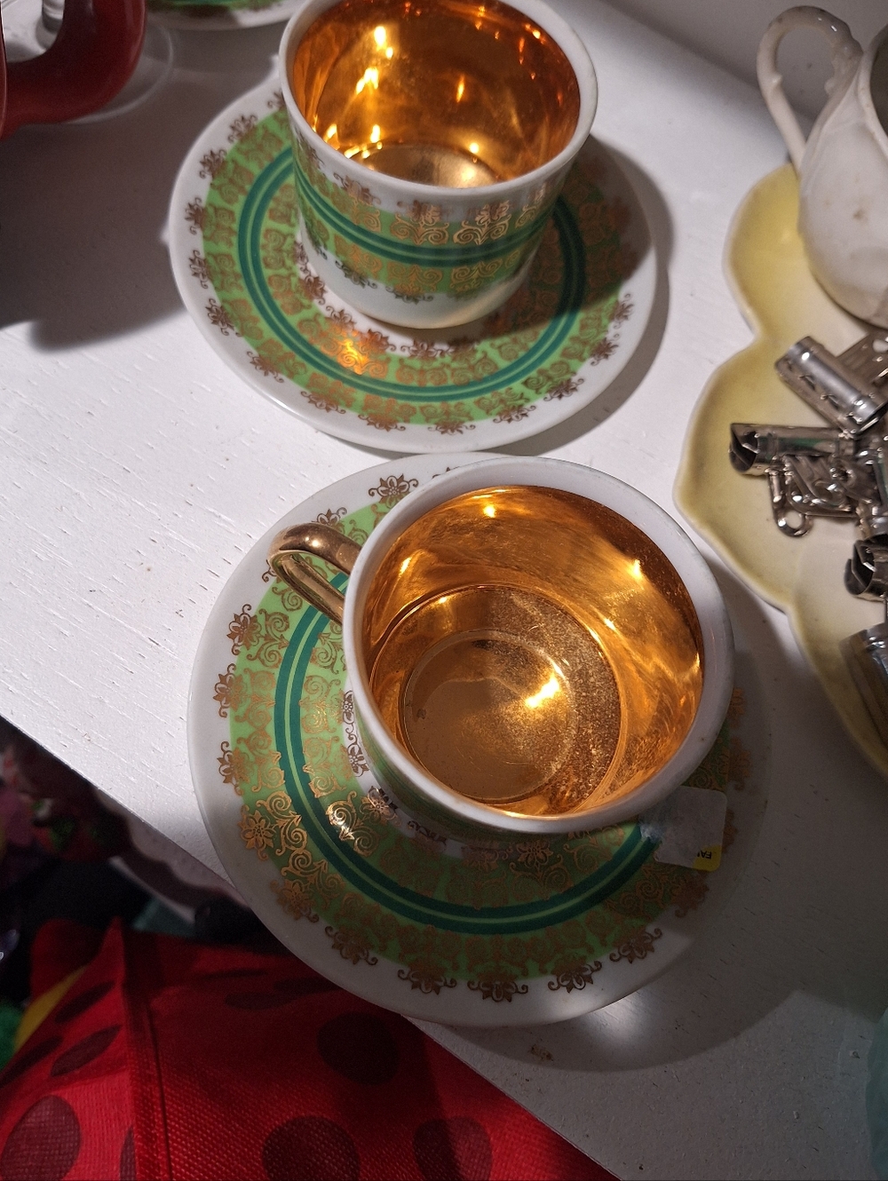 LAURA CZECHOLOVAKIAN GOLD GILDED TEA CUPS AND SAUCERS. SET OF 2